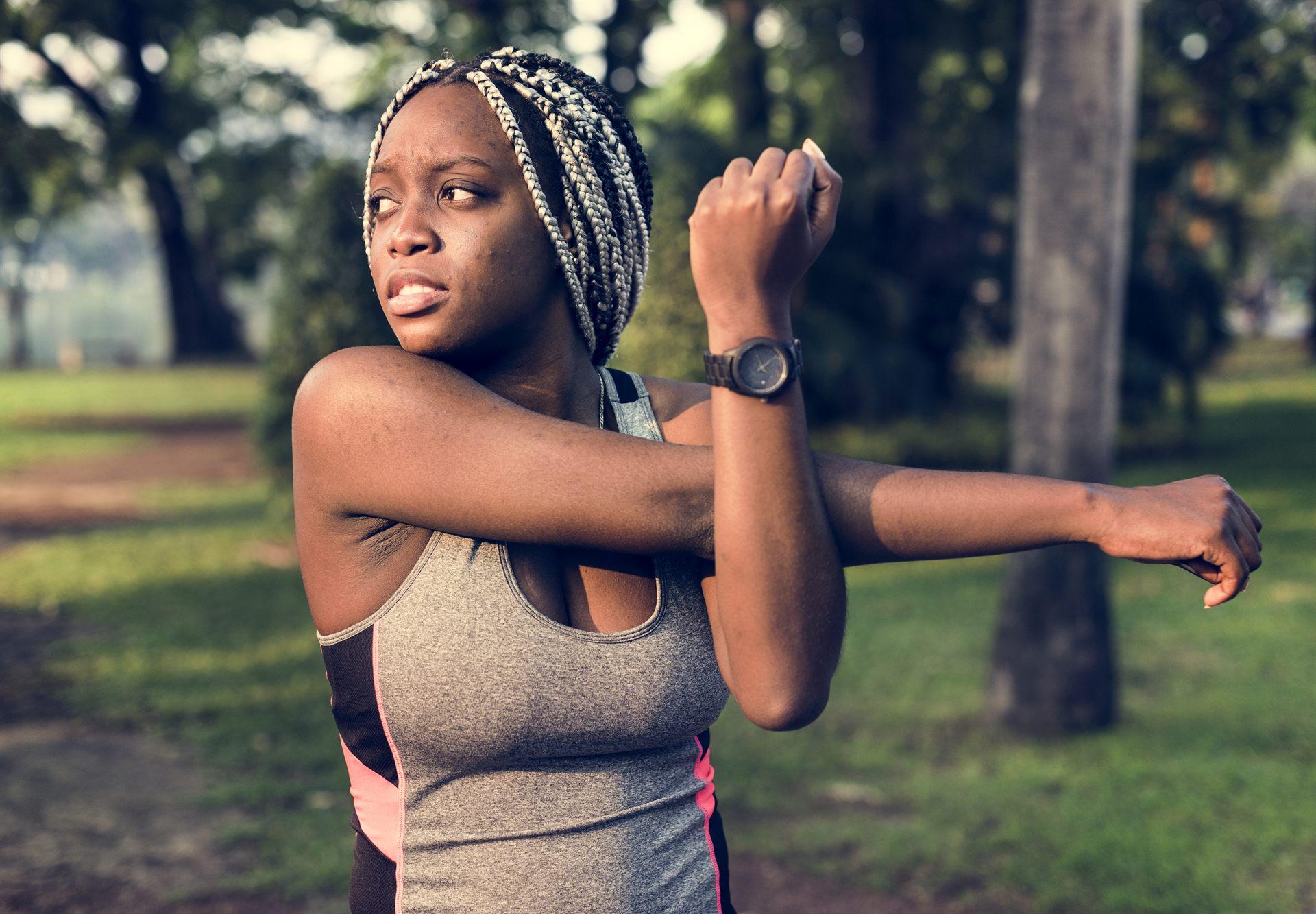 People stretching outdoors as part of an active, healthy lifestyle